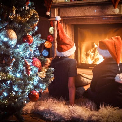 two children near the fire, at christmas time
